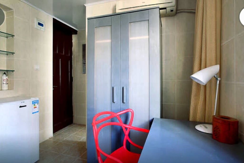 With one desk and chair. One mini-refrigerator and a closet.