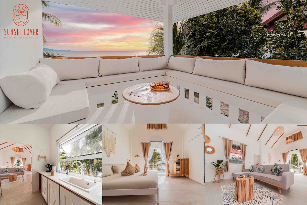 A spacious outdoor seating area features comfortable cushions and a wooden table, all set against a backdrop of vibrant sunset colors. Inside, a modern kitchen with sleek countertops and a cozy living area showcases neutral decor and natural lighting, creating a peaceful retreat.