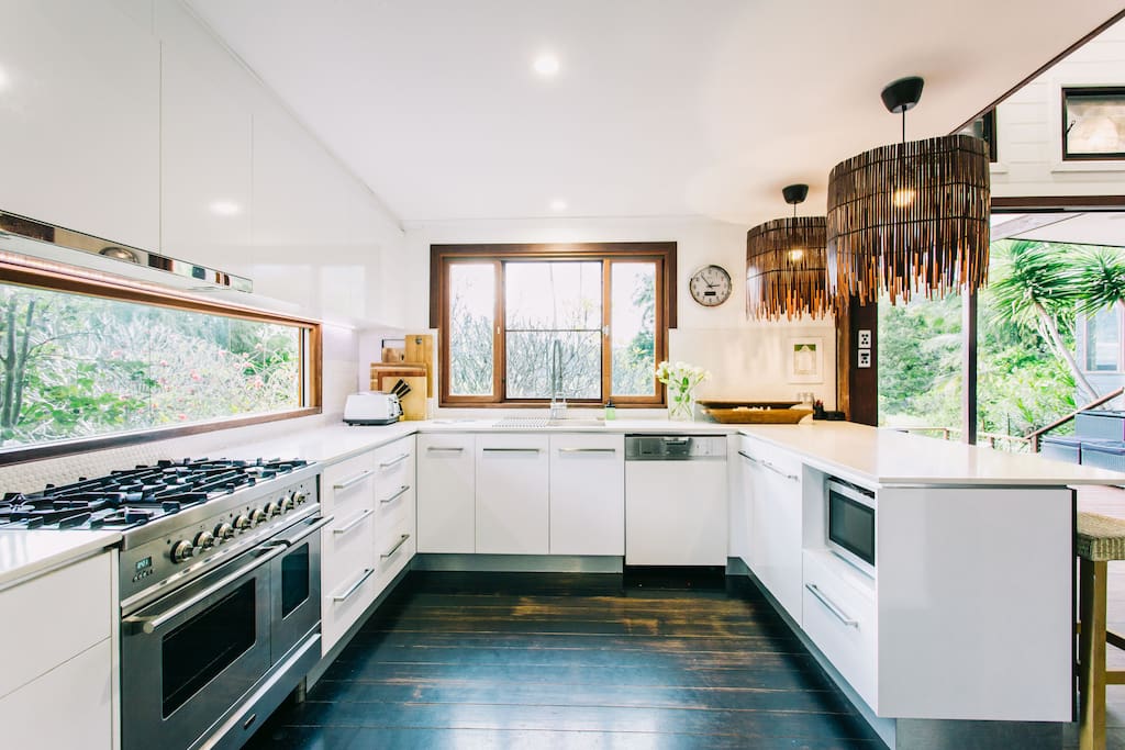 Cook up a feast in the vast open planned Kitchen, equipped with all the mod-cons (including a commercial coffee machine (BYO coffee beans) with spectacular views of the garden.