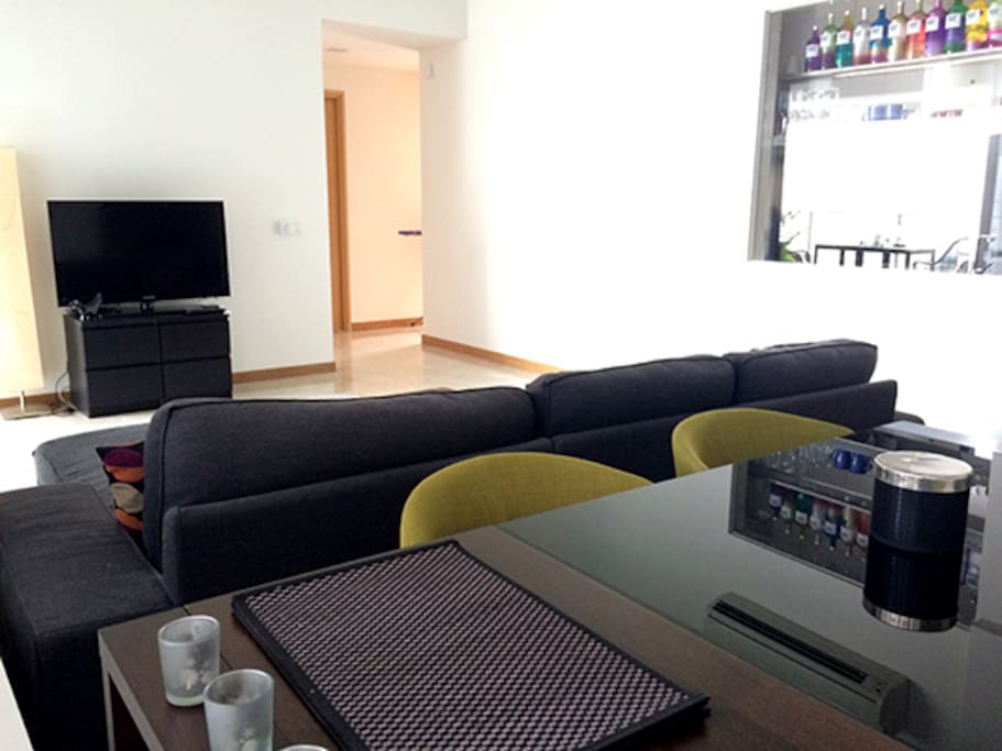 View from dining table over the living room, towards bedroom
