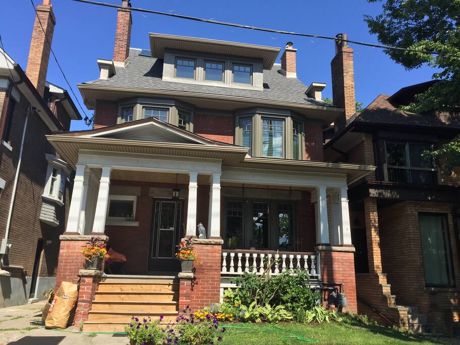 Century old High Park home features a large front porch
