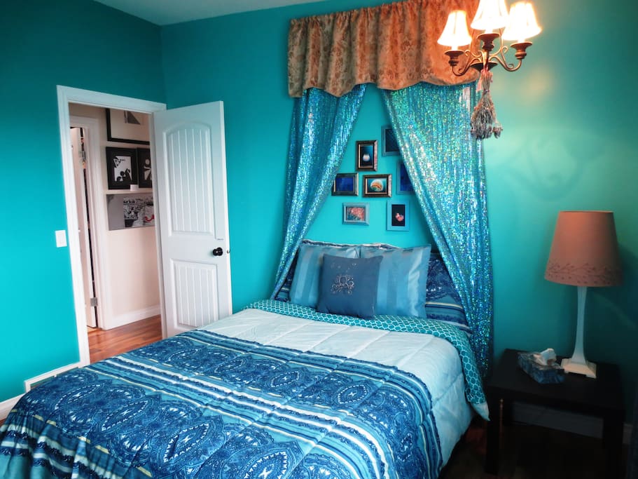 Your room with mermaid themed decor comes with a double bed, desk and seating for two