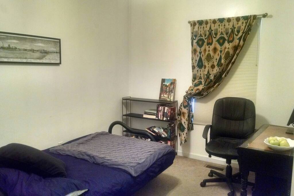 Secondary guest room sleeps two and is great for an extra work or play space.