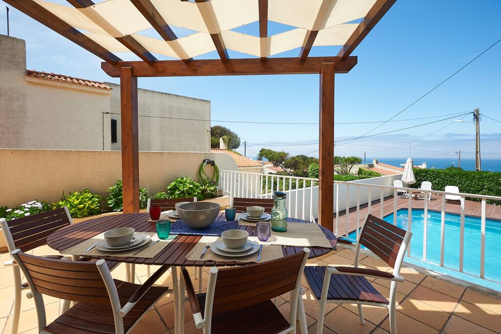 pergola facing swimming pool and sea view