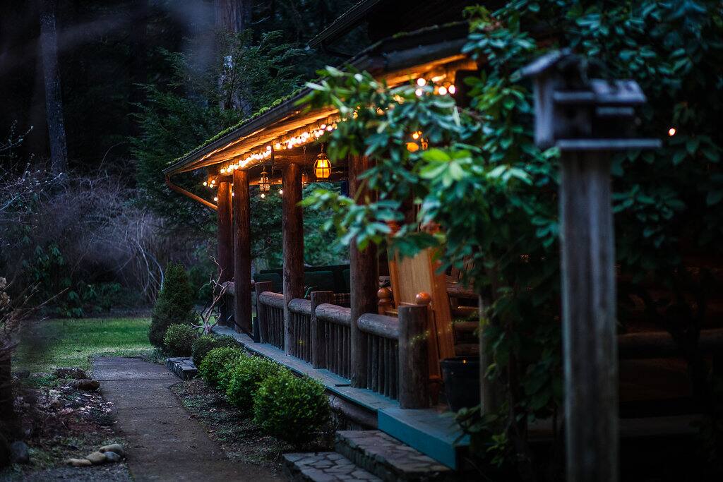 Lovely front porch, back porch, a loft, balcony, and multiple tables create the perfect locations to gather & collaborate with the woods as your backdrop.