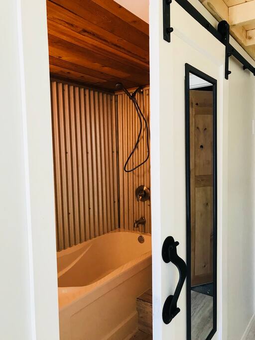 Sliding barn door to the private ensuite