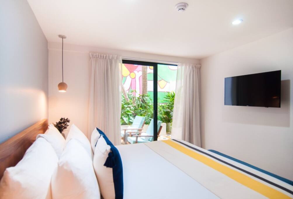 Our courtyard room "Diego" takes inspiration from famed muralist Diego Rivera.