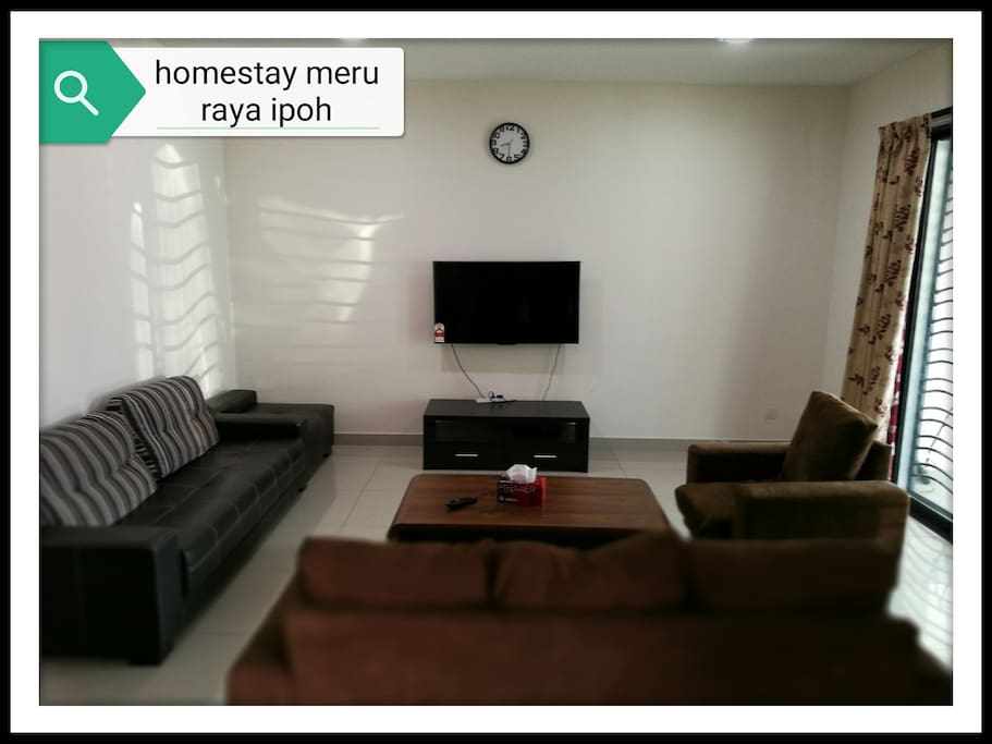 spacious living room with 2 types of sofa,aircond,large HD tv with astro