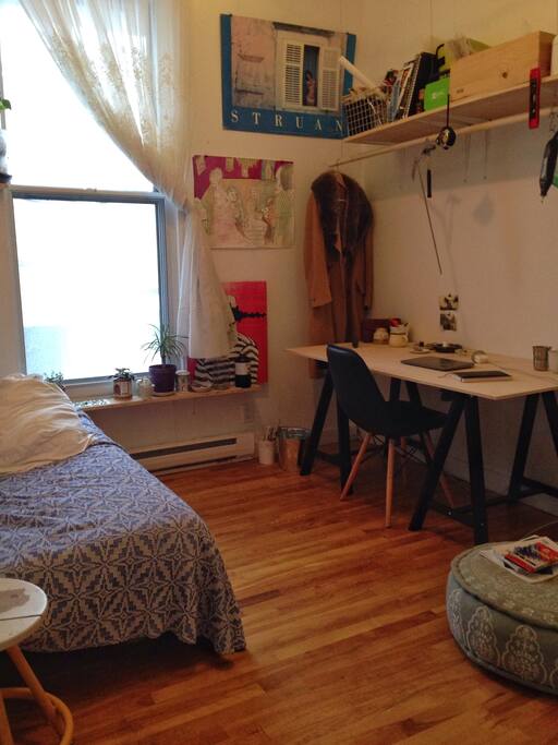 When the bed is tucked away, you have access to a work-table. *note the bright window!