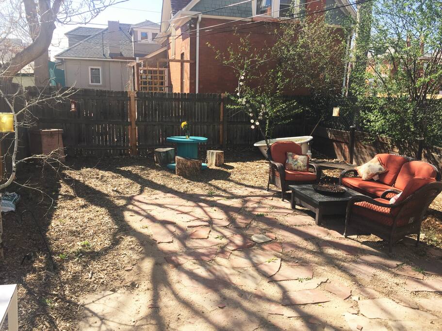Private backyard with easy propane fire pit