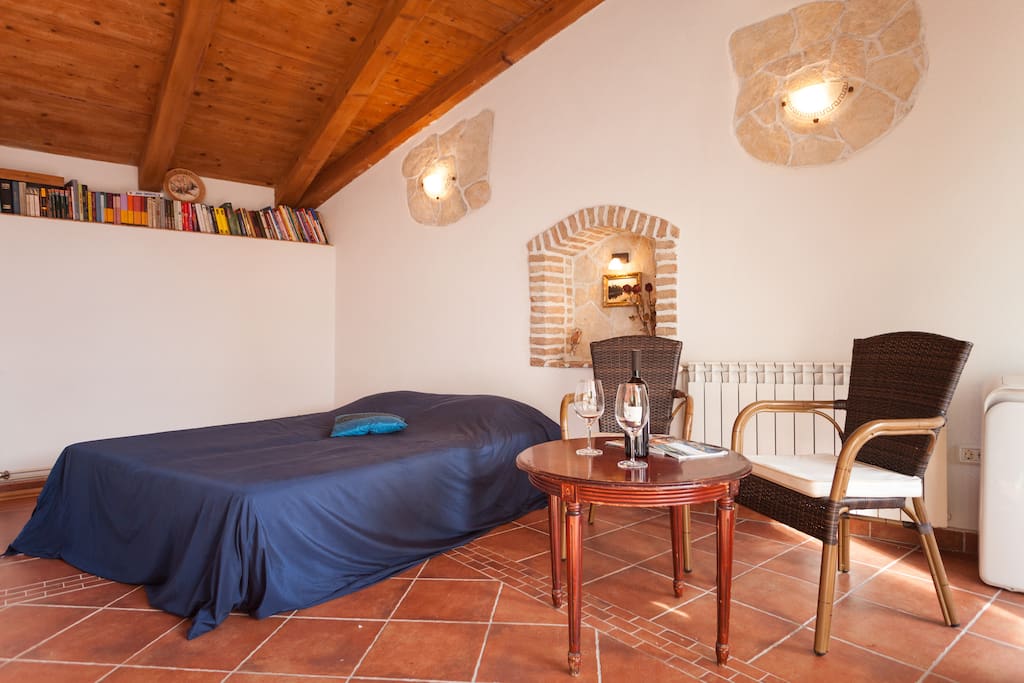 Room with the bed, table and a little book shelf - anyone who wishes can read a book on their stay. If you wish to take a book outside of the house (to the beach or trip around Rovinj) - it's important to ask us!