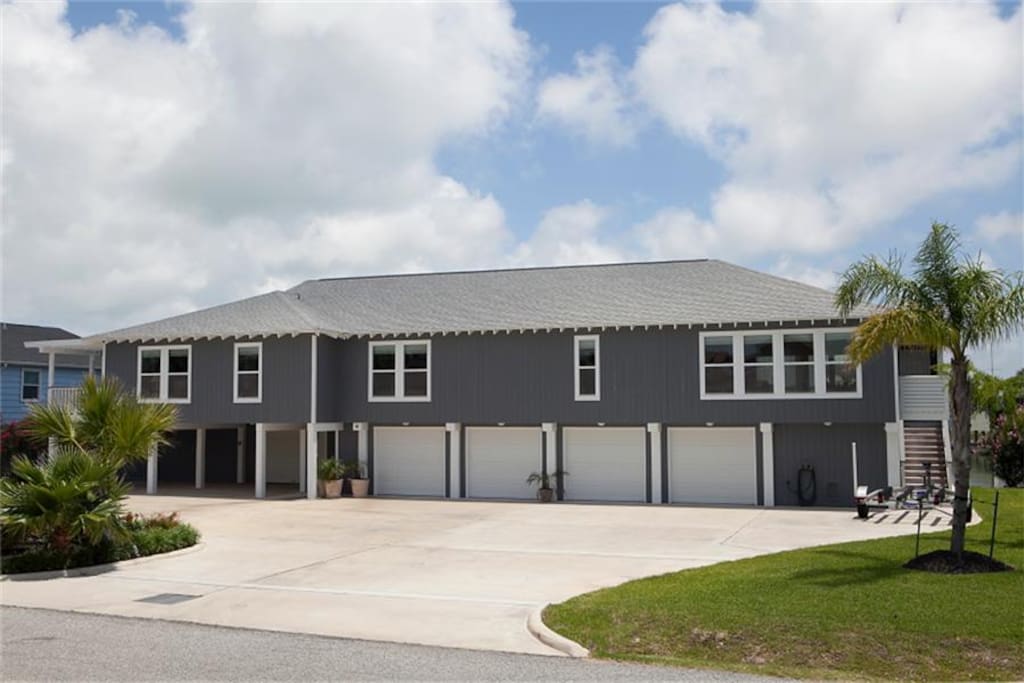 Front of the house with large parking area.