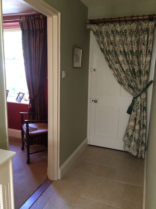 The private entrance leads into the guest quarters which include private dining room and sitting room and stairs up to the bedroom and guests shower room