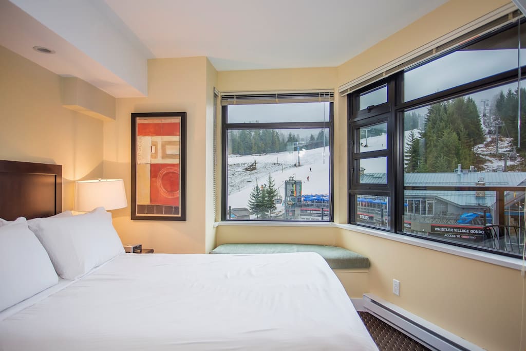 Get a good night's rest in this lovely bedroom with loads of natural light and a reading nook!