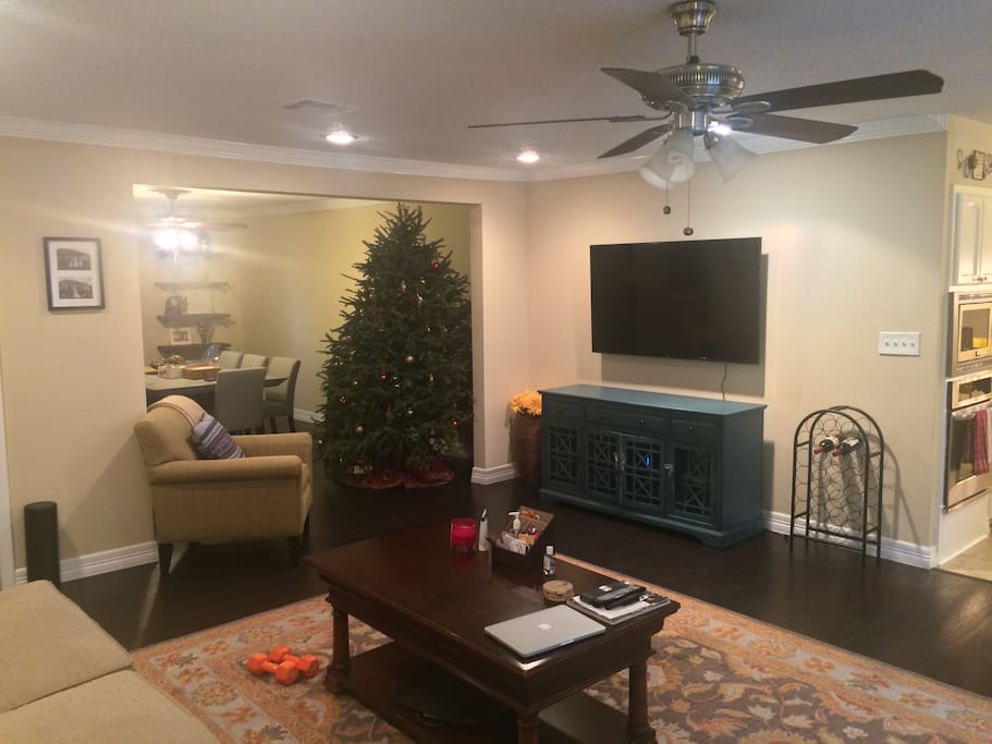 Open concept living area with spacious living, dining and kitchen area.