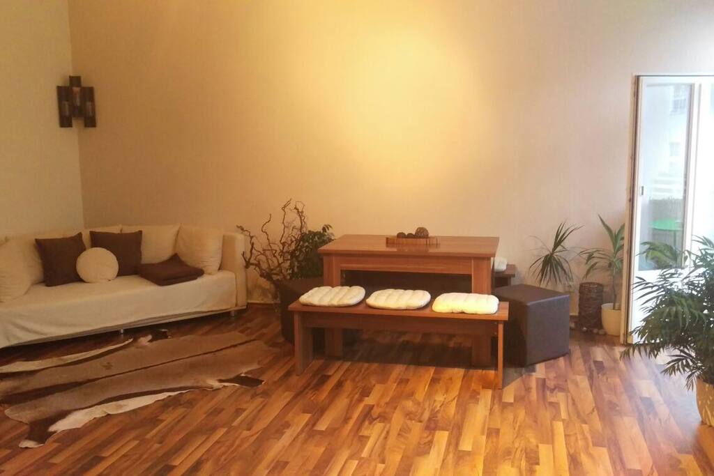 Living room: dining area and additional sitting area (can be turned into guest bed)
