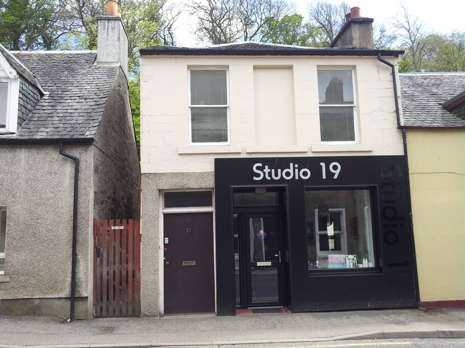 front door of the property and access next to studio 19 hairdressers