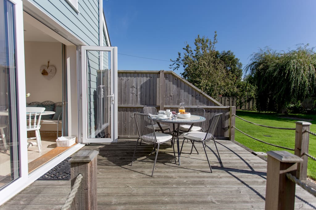 Private decking area with south facing views over the mature garden complete with birds and resident red squirrels who visits the lawn frequently.