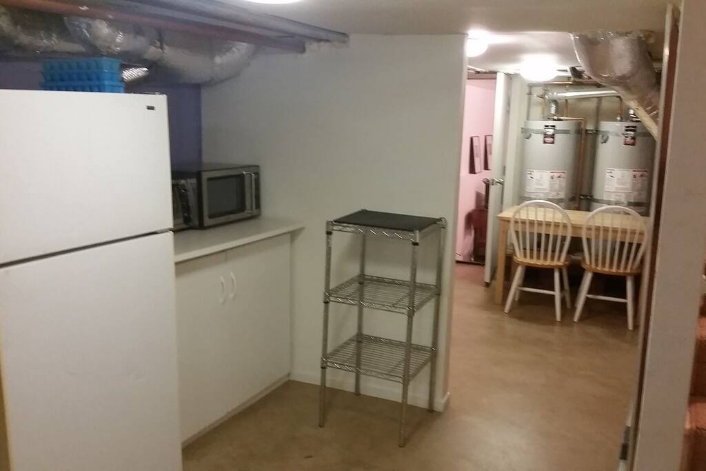 Kitchenette with microwave, toaster oven, flatware, cutlery for light meals and snacks