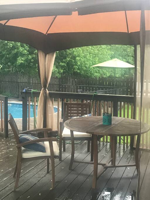 Space perfect for a BBQ with a grill, 2 tables and seating for 8.