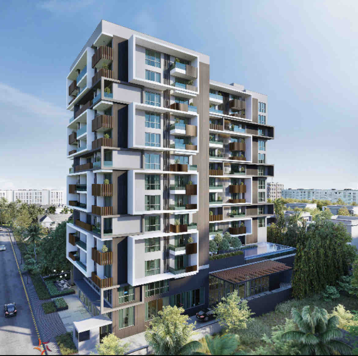A modern multi-story building is showcased, featuring large glass balconies and a combination of light and dark exterior materials. Surrounding landscaping includes lush greenery. The street in front is lined with trees, enhancing the urban aesthetic of the area.