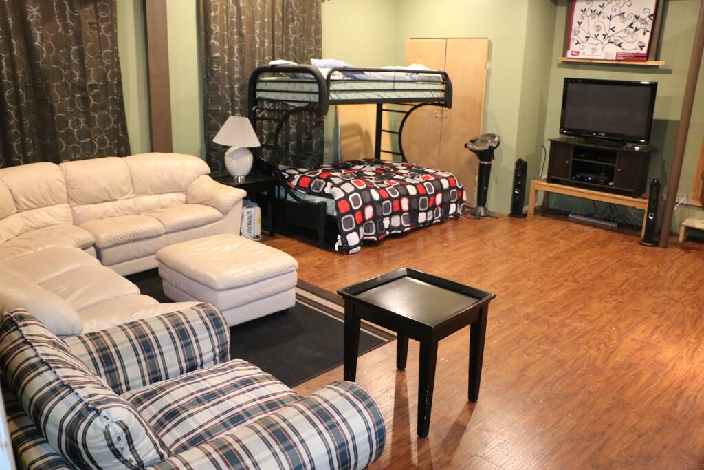 Wooden flooring with Bunk Beds and a pull out bed.