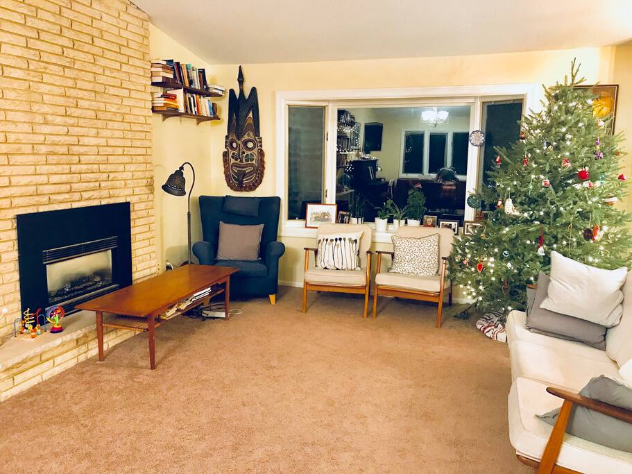 Spacious living room with fireplace, and overlooking lake