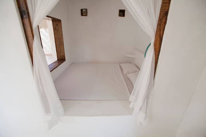 The Lamu/Swahili-inspired bedroom on the first floor of the tower