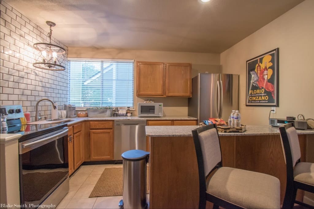 Full sized kitchen with all the essentials! Cook top stove, oven, dishwasher, microwave and refrigerator. Fully stocked with cookware, dishes and utensils.