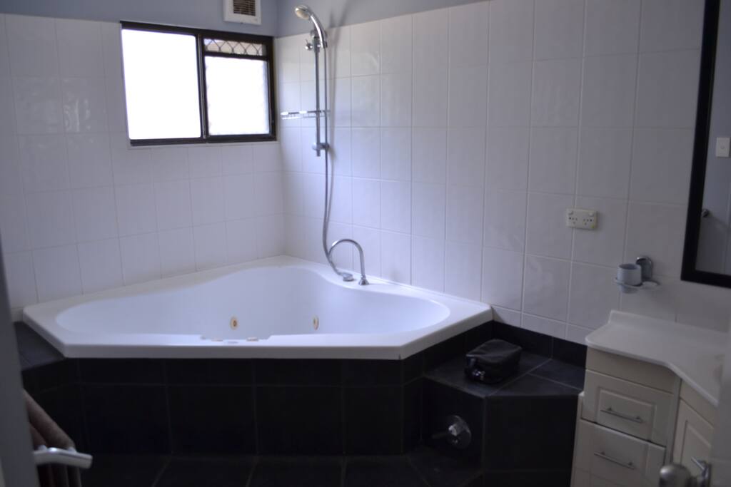 Shower over Spa Bath with continuos gas hot water