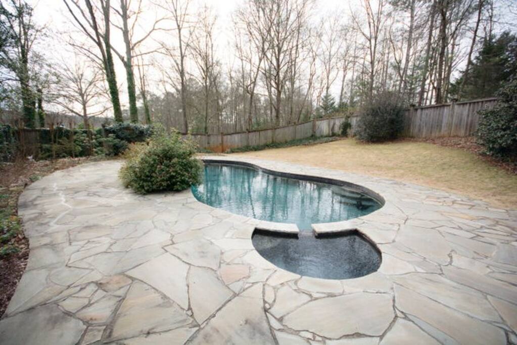 Large heated pool with attached hot tub