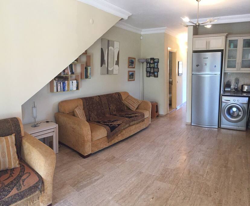 The living/kitchen area also includes a double sofa bed