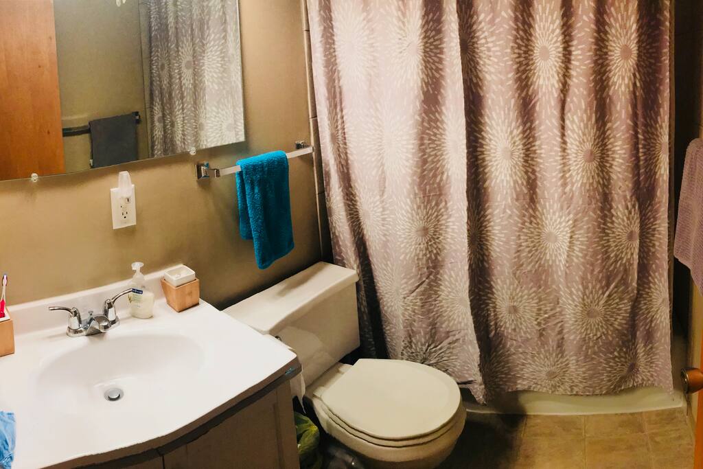 Full size bath tub and shower with a few necessities included