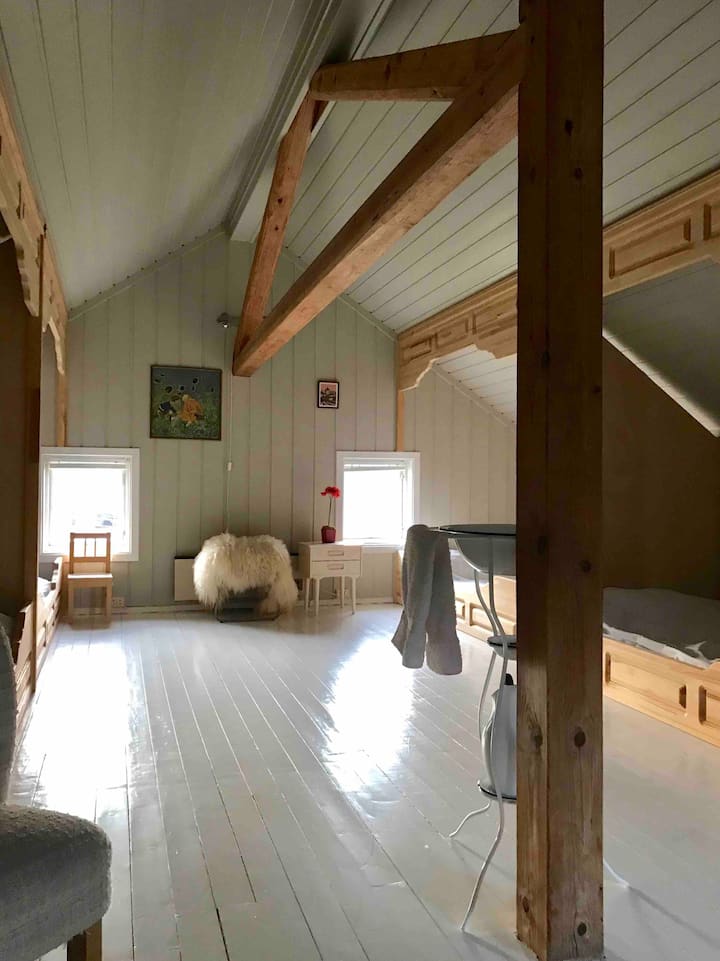 Stay in the converted farm building, the 'stabbur'. We have four small double beds here. 