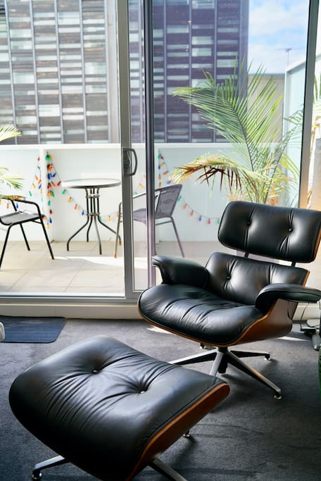 Luxurious eames chair with ottoman.