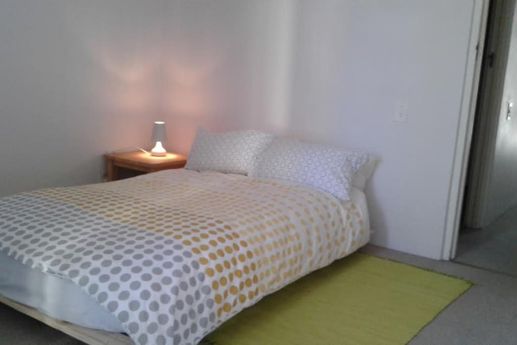 Guest room with double sized extra length futon bed.