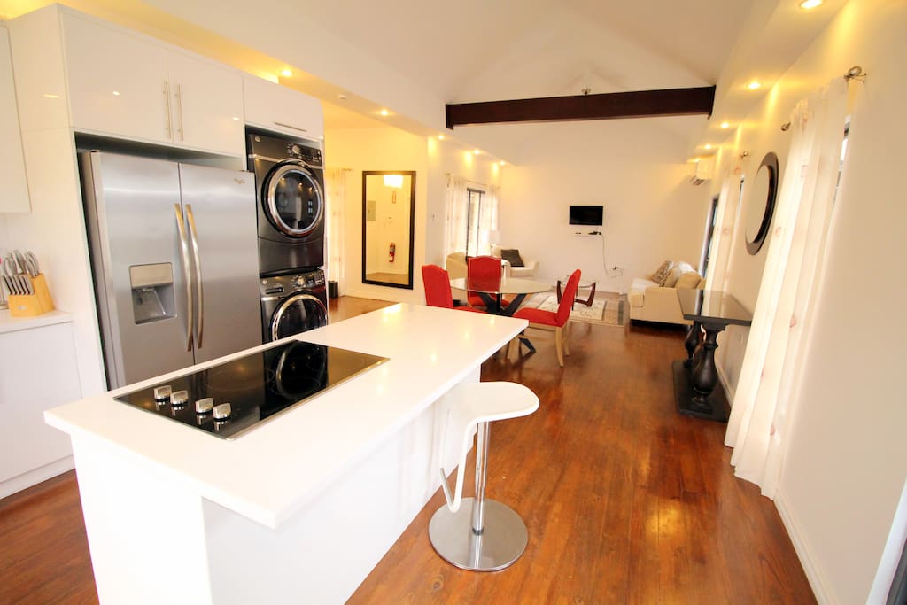 Open plan kitchen - dining and living room area.