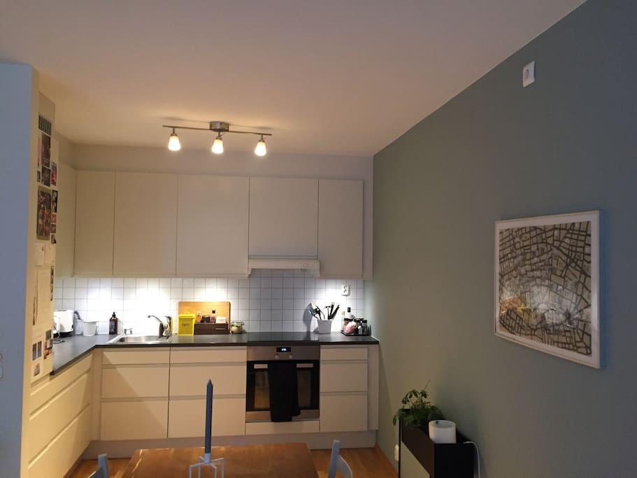 Kitchen with dish washer machine, fridge and freezer