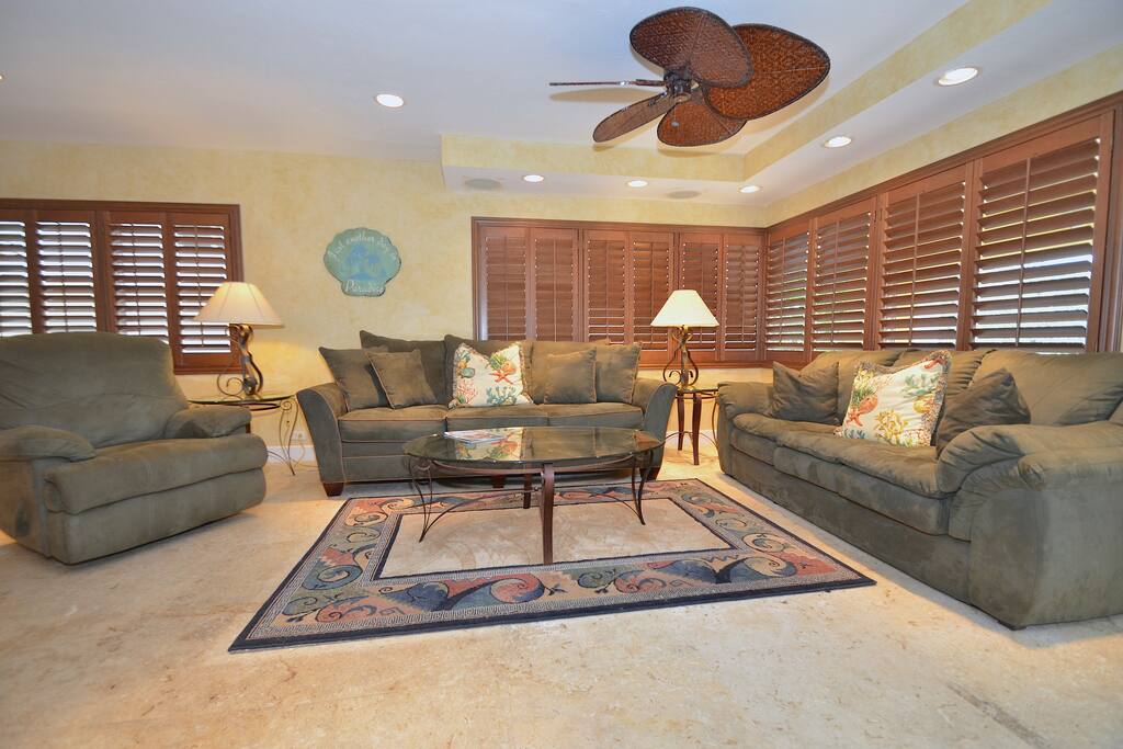 Spacious Open Living Area Offers Two (2) Full Size Sofas, Recliner Chair & 60 Inch LED High Def TV + Surround Sound System...