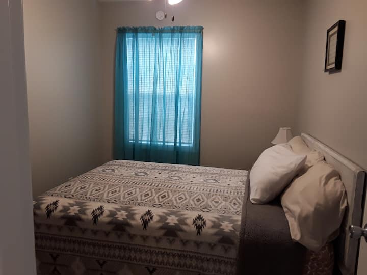 Bedroom #1 features a comfy Queen size bed with clean linens and extra blankets.