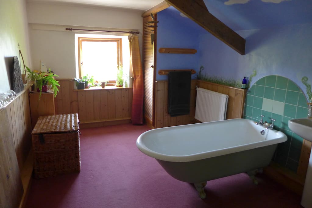Bathroom with roll top bath