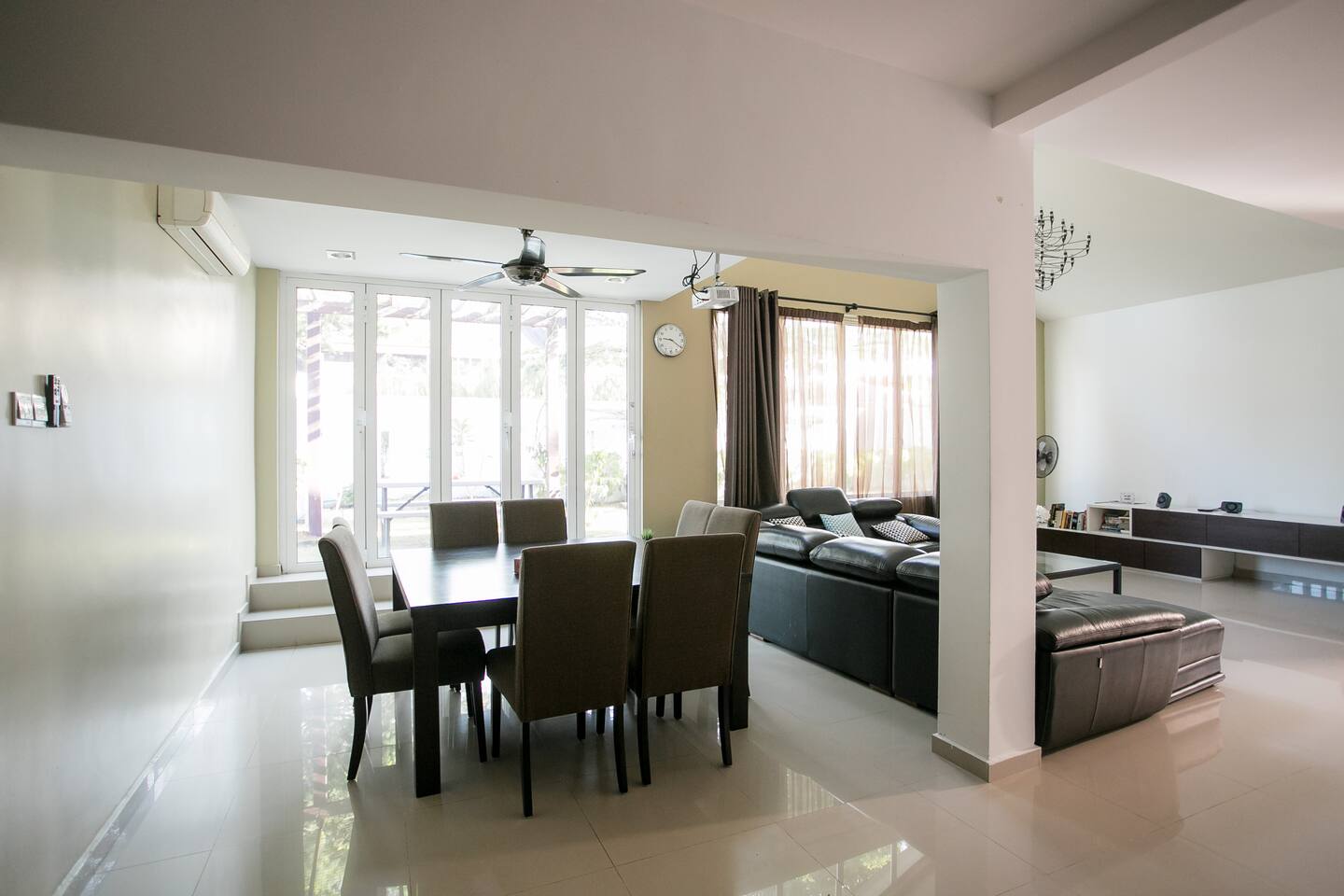 The large square dining table overlooks the living room and fits 8 comfortably. 