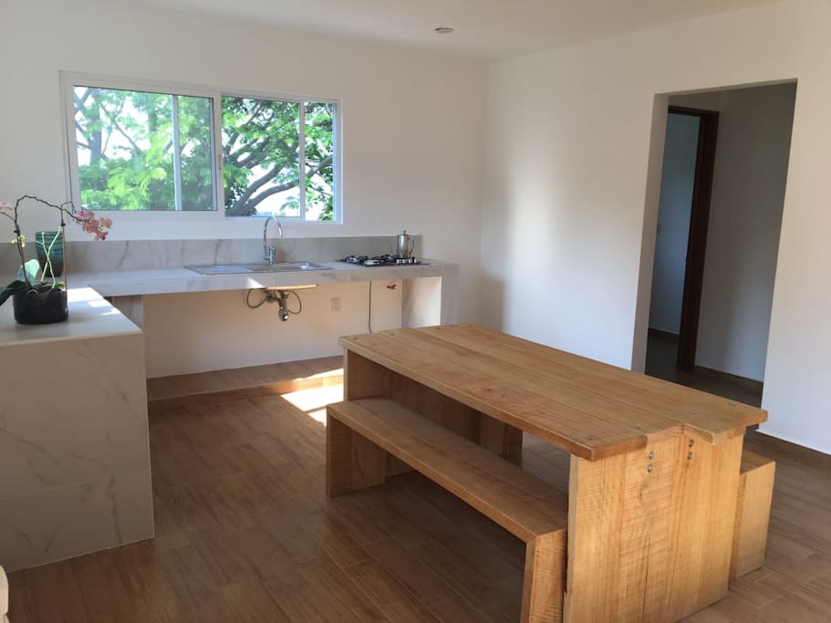 Kitchen and dining area in minimalist style.