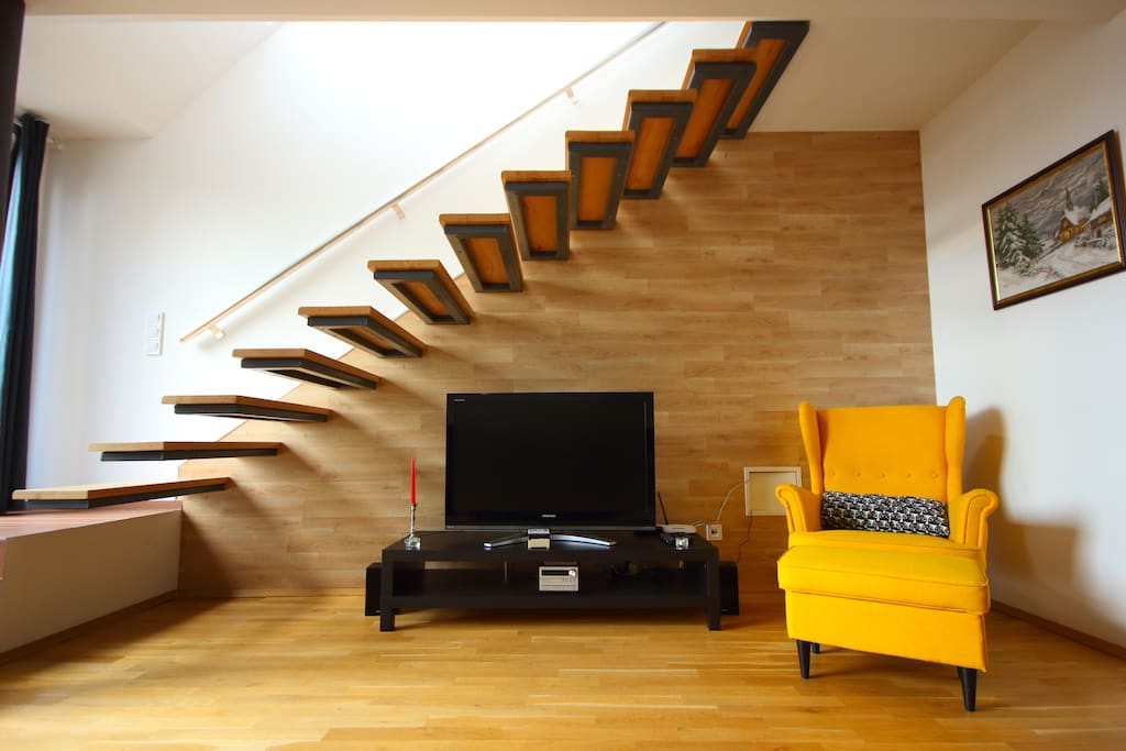 Living room - cable TV, stereo and a great armchair for reading or working by the fireplace.