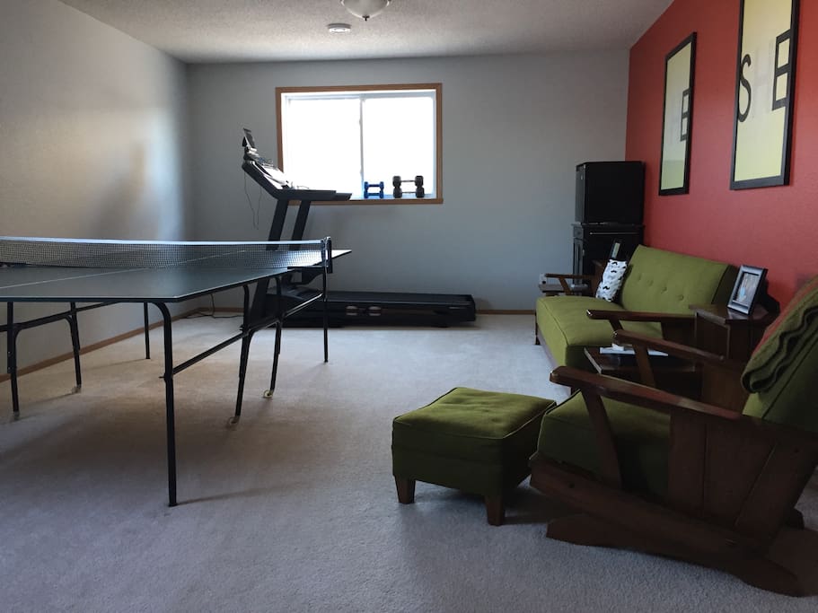 Ping pong table, treadmill, mini fridge, and coffee maker