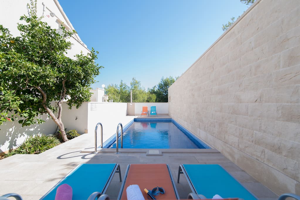 Lovely pool area with sunbeds