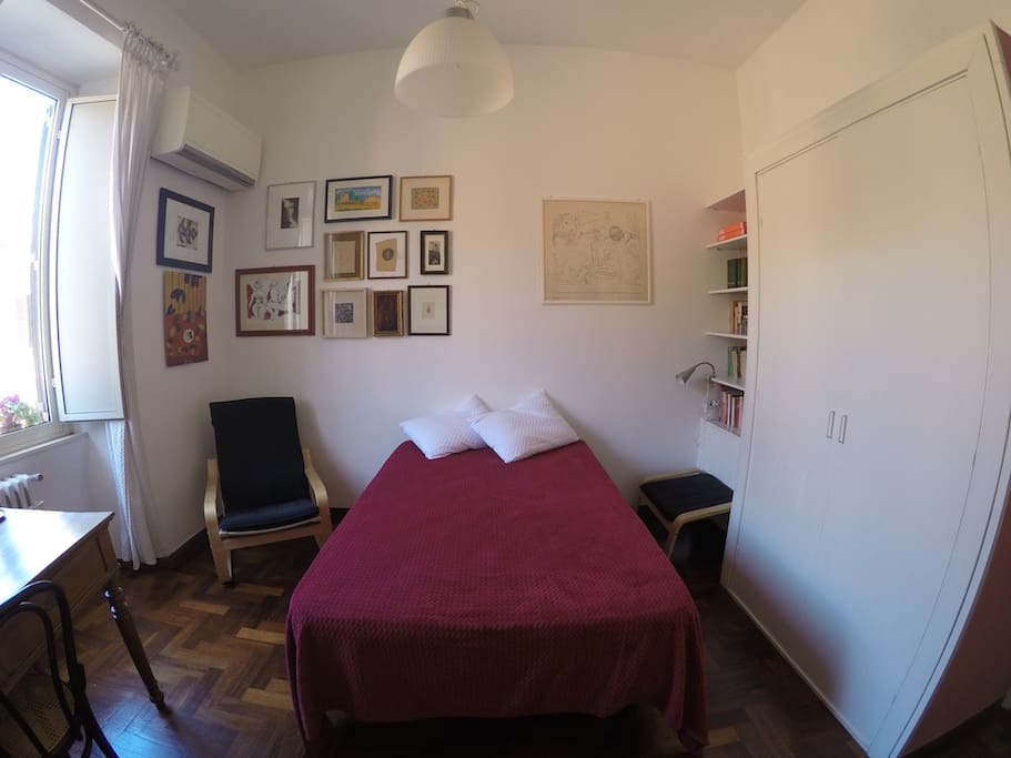The room: armchair, armoire.