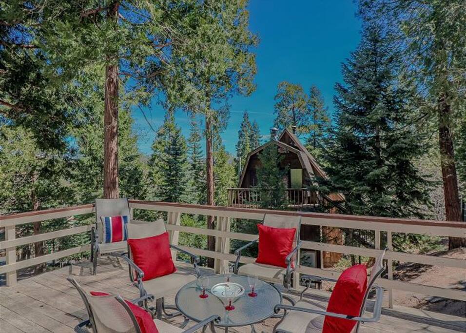 Deck includes outdoor seating and BBQ.