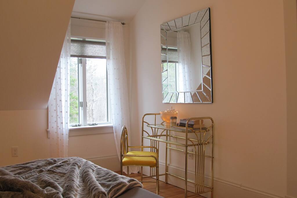 Your room features an antique dresser & chair topped off with a huge mirror for all your making yourself look great needs.