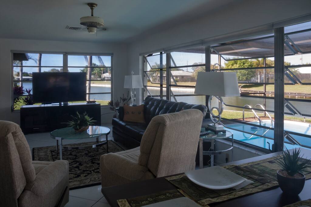 Family room overlooking pool area and lake.